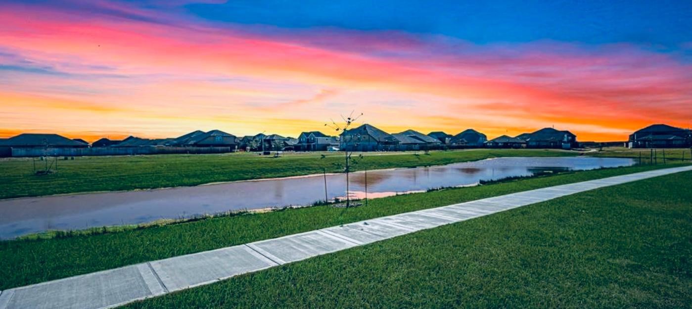 10314 Birch Peak Drive Rosharon, TX 77583 - Photo 34 of 38 a view of a lake with a yard