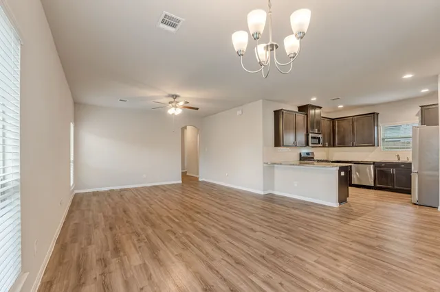 a view of kitchen with cabinets and wooden floor