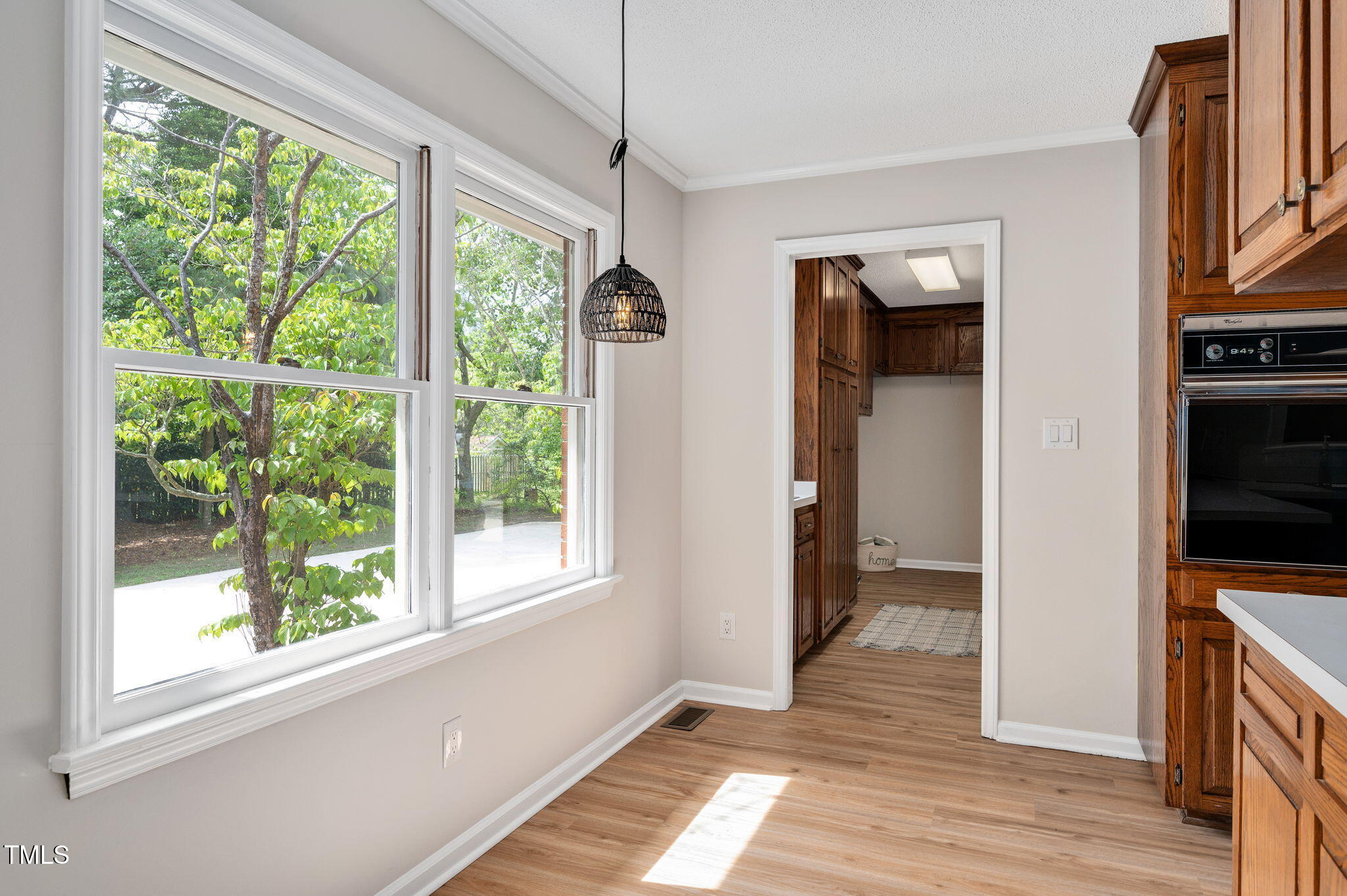 603 Warren Road Erwin, NC 28339 - Photo 16 of 38 a view of hallway with wooden floor and a window