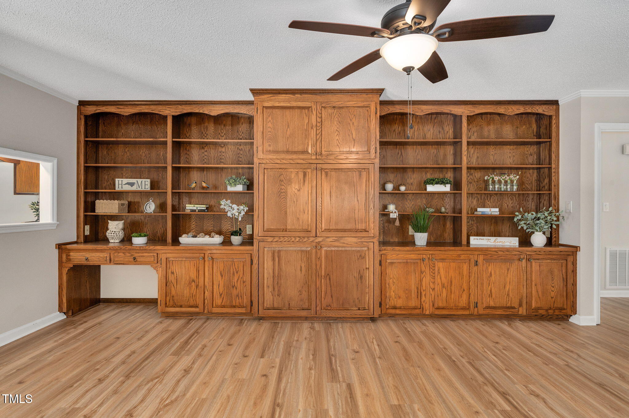 603 Warren Road Erwin, NC 28339 - Photo 19 of 38 a view of empty room with wooden floor and cabinet