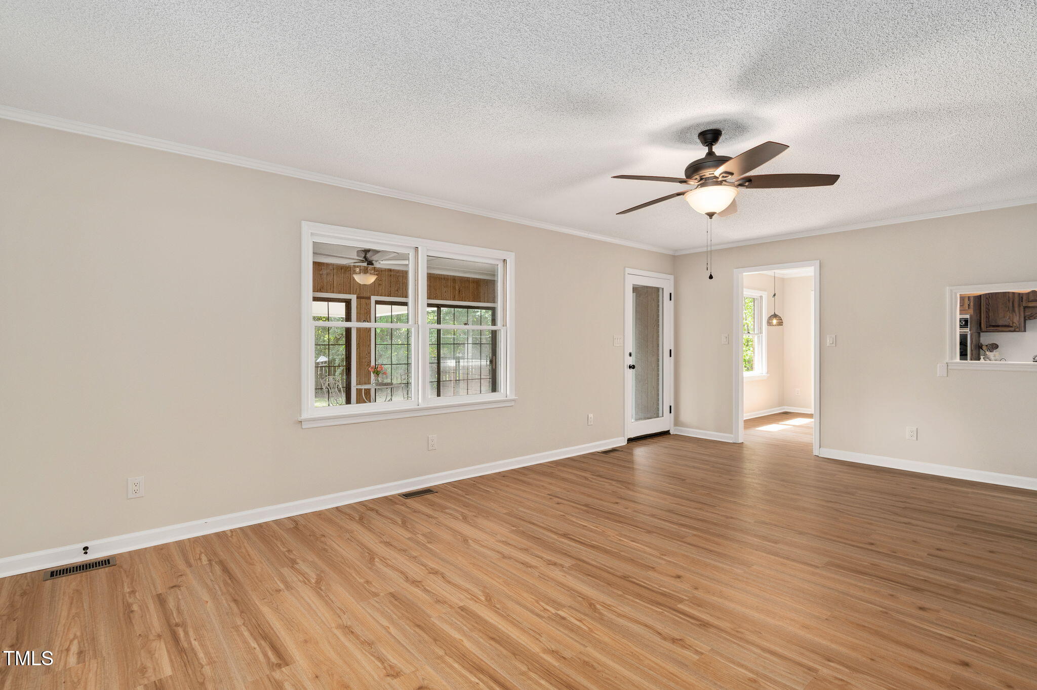 603 Warren Road Erwin, NC 28339 - Photo 21 of 38 a view of an empty room with a window and wooden floor