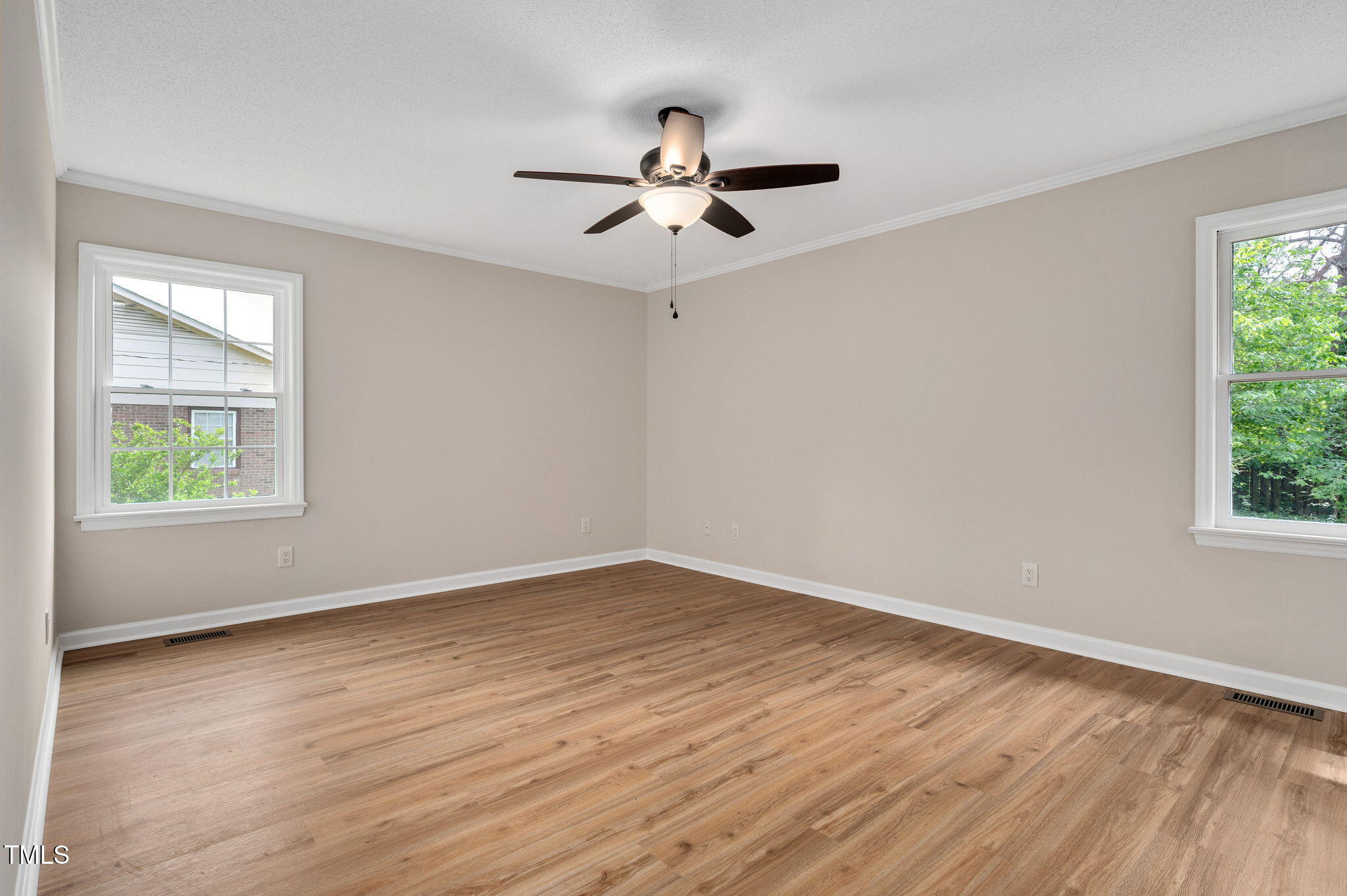 603 Warren Road Erwin, NC 28339 - Photo 24 of 38 a view of empty room with wooden floor and fan