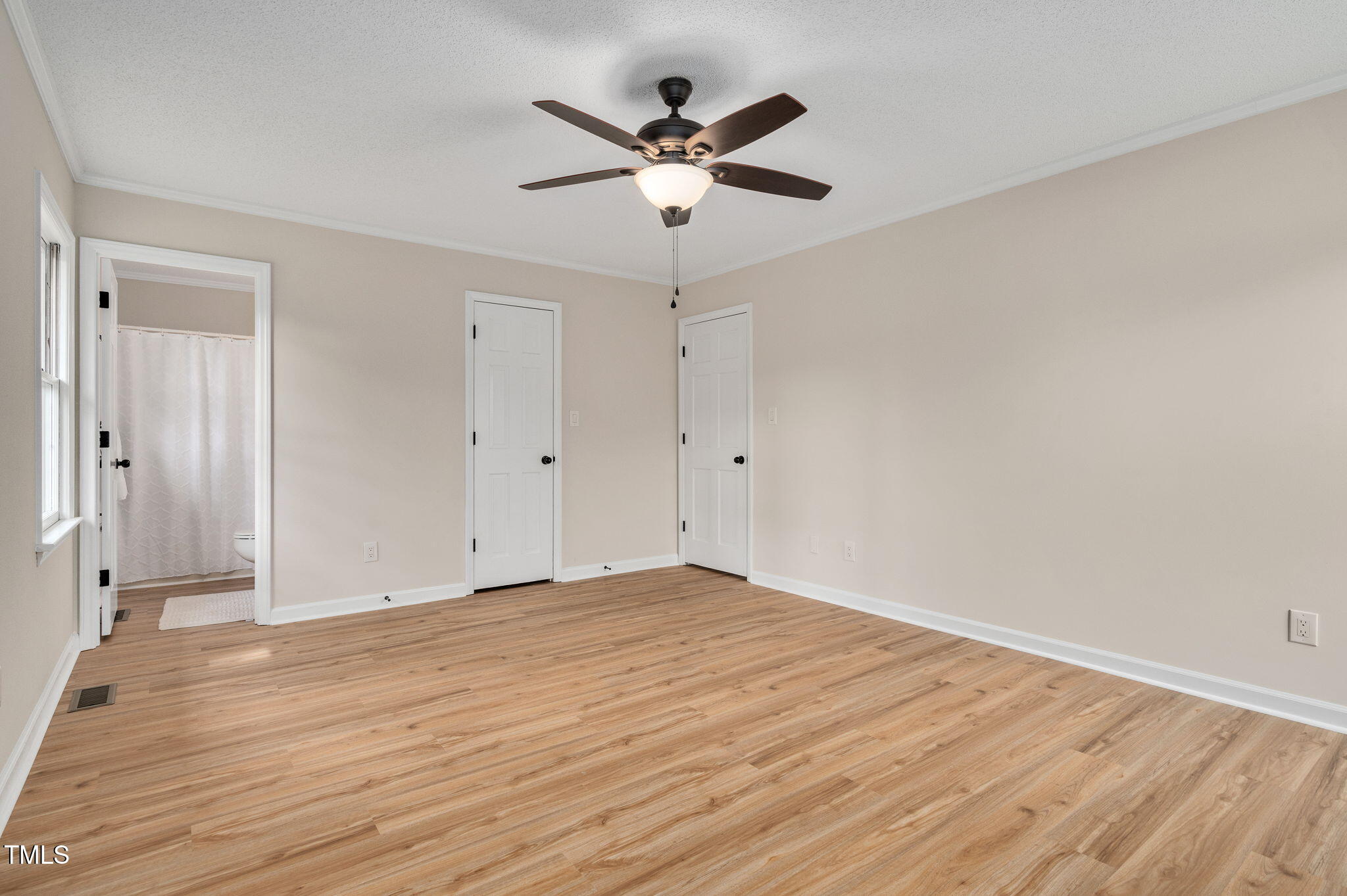 603 Warren Road Erwin, NC 28339 - Photo 25 of 38 an empty room with wooden floor and ceiling fan