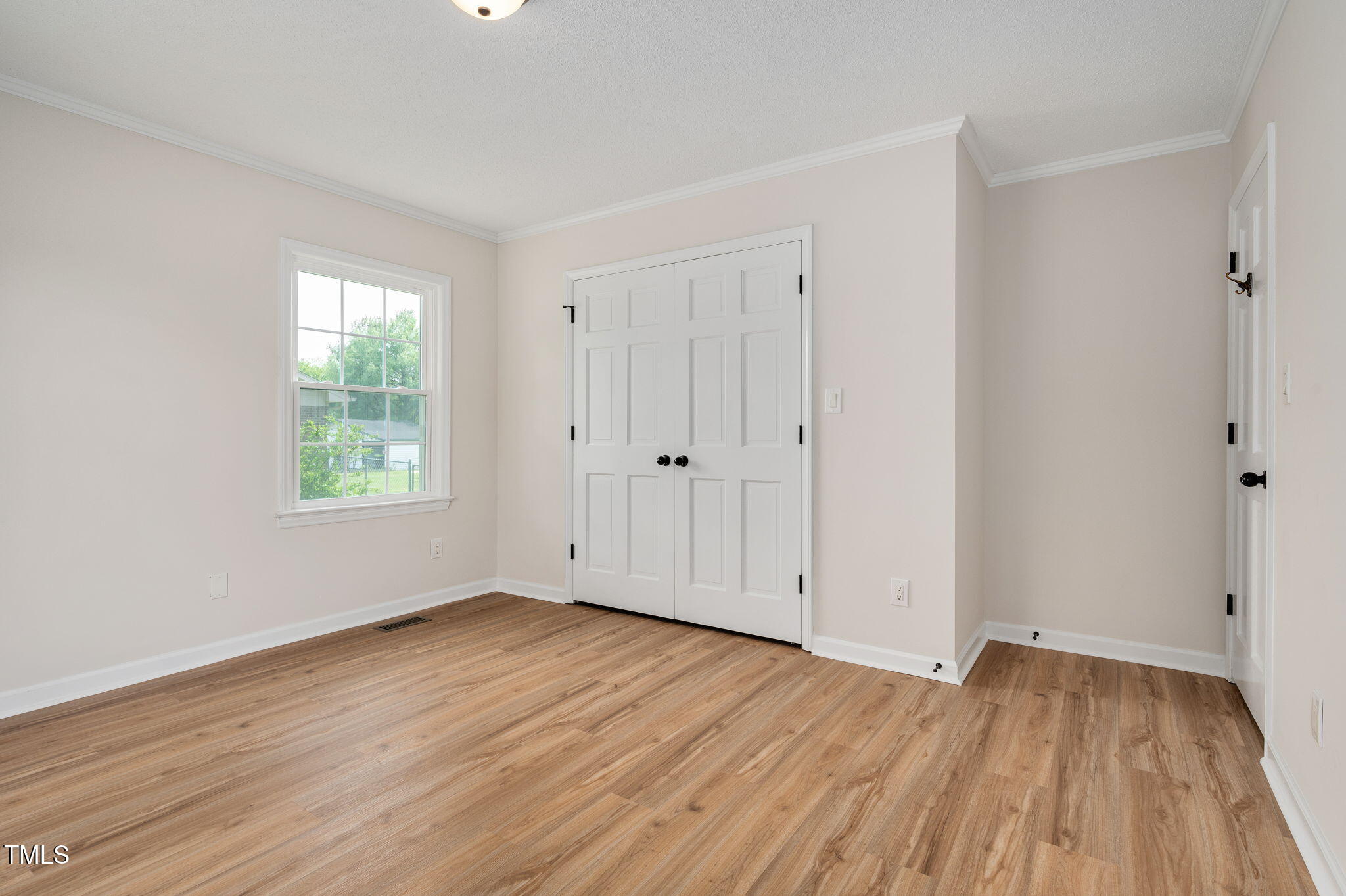603 Warren Road Erwin, NC 28339 - Photo 28 of 38 a view of an empty room with wooden floor and a window
