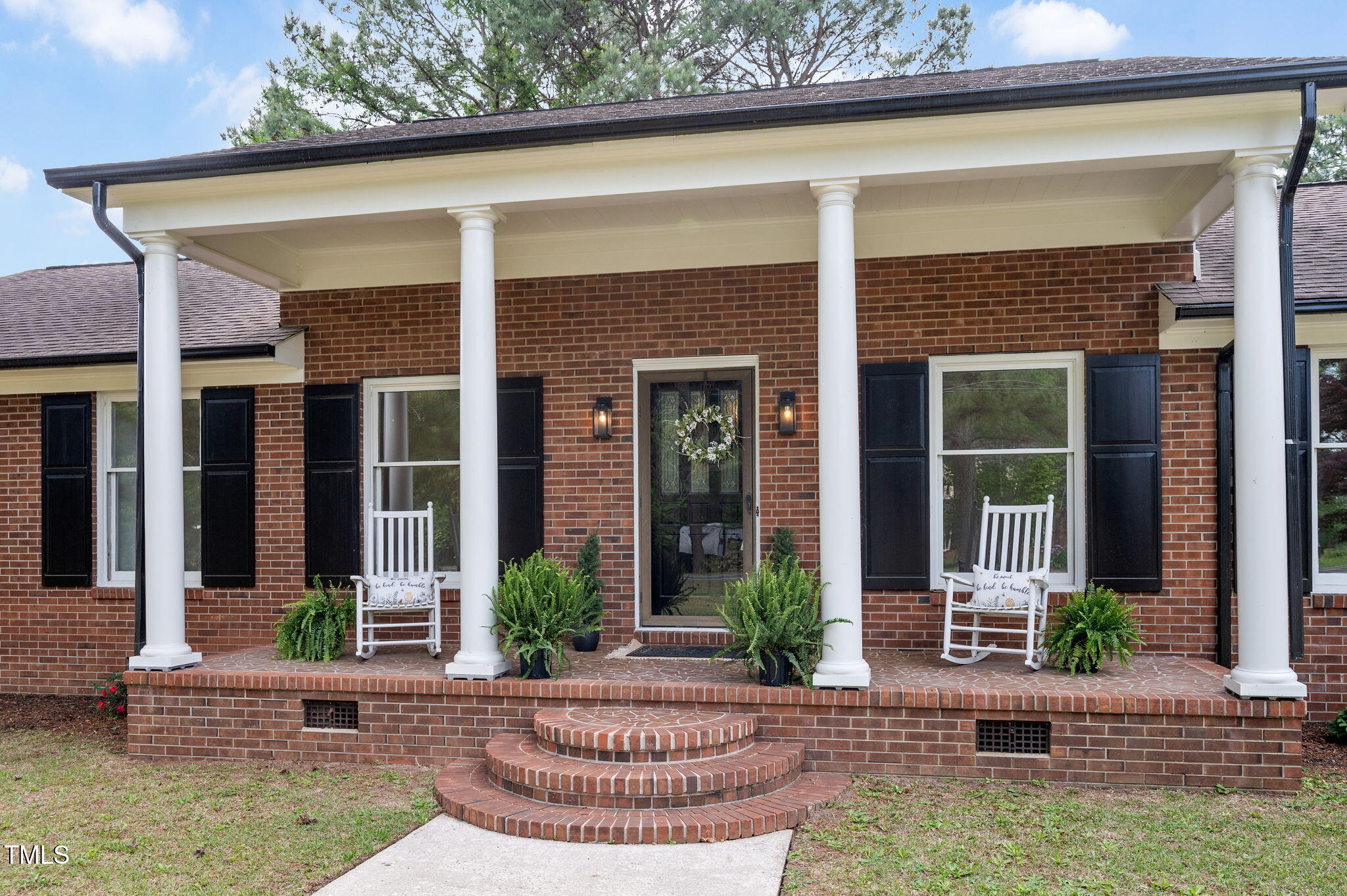 603 Warren Road Erwin, NC 28339 - Photo 2 of 38 a front view of a house with porch and furniture