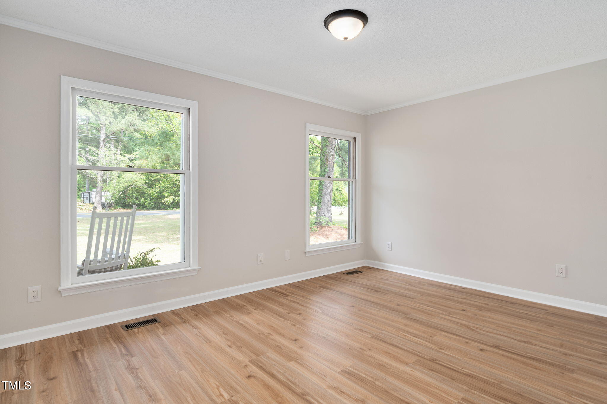 603 Warren Road Erwin, NC 28339 - Photo 30 of 38 a view of an empty room with wooden floor and a window