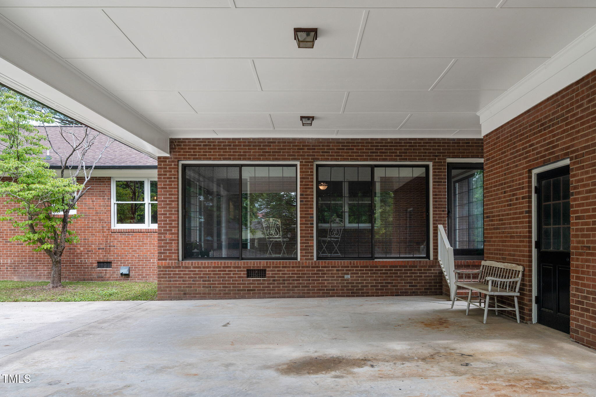 603 Warren Road Erwin, NC 28339 - Photo 37 of 38 a front view of a house with garden and chairs