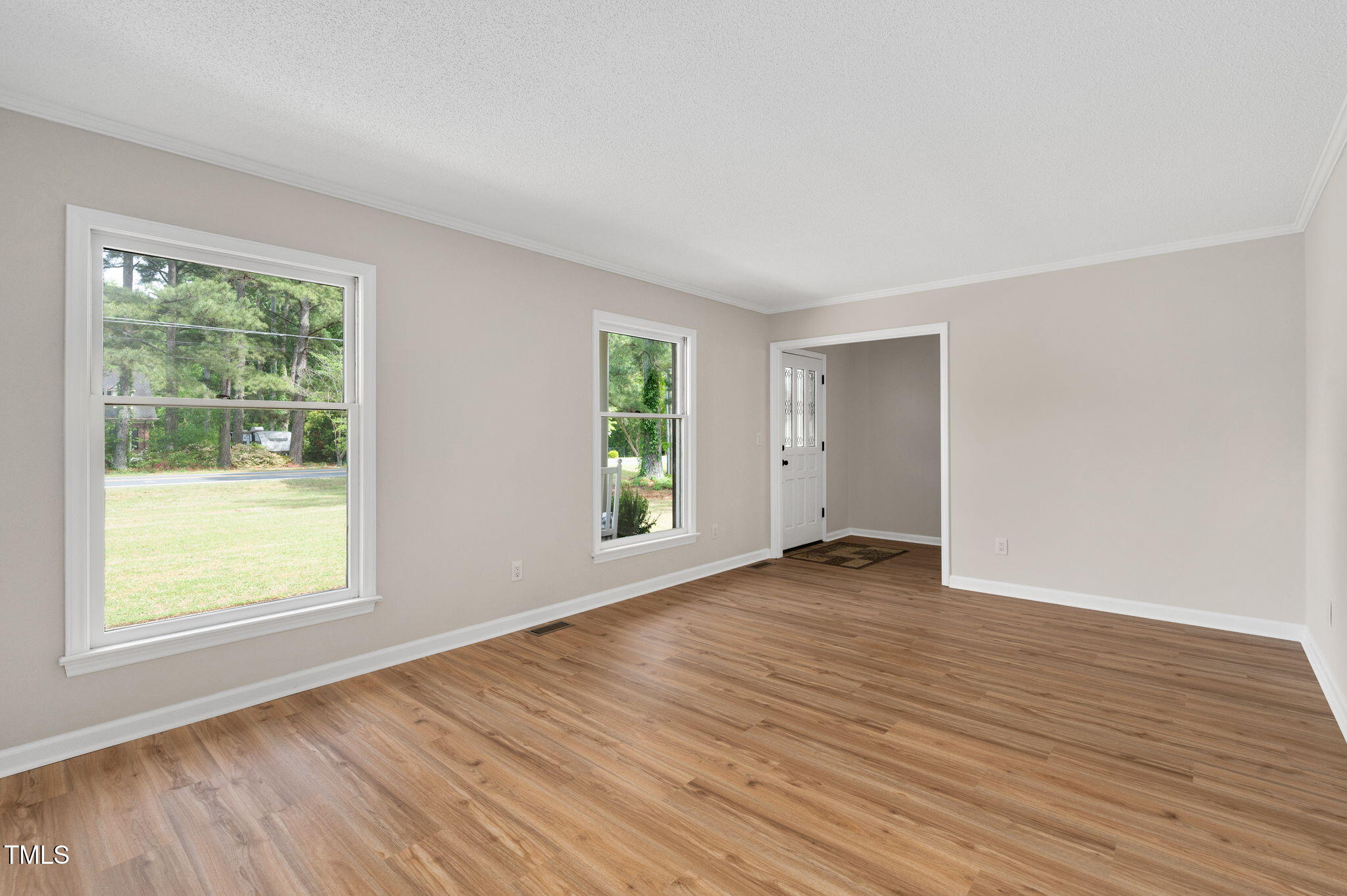 603 Warren Road Erwin, NC 28339 - Photo 9 of 38 a view of an empty room with wooden floor and a window