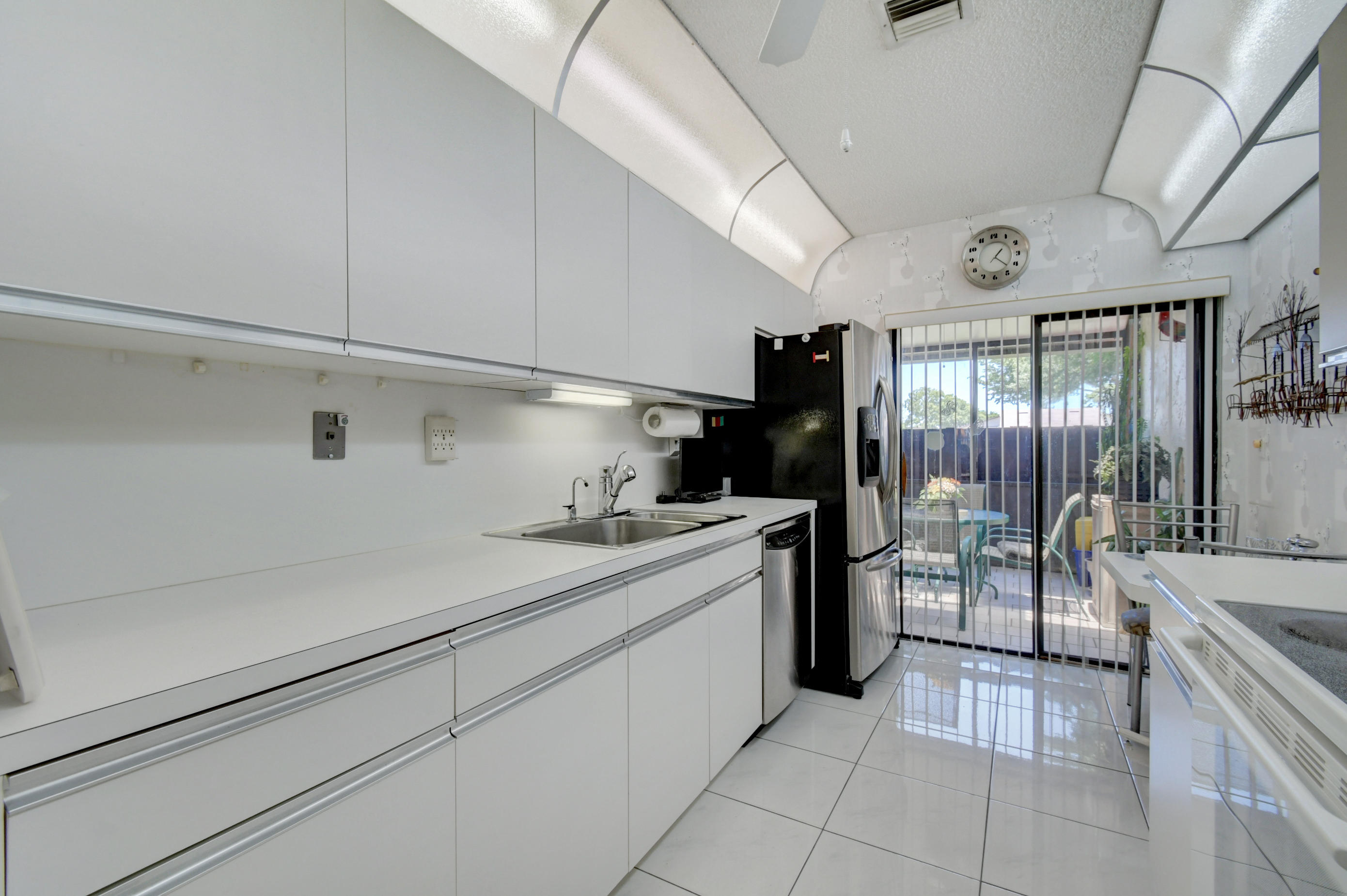 14163 Nesting Way, Unit D Delray Beach, FL 33484 - Photo 16 of 45 Eat in Kitchen with patio view