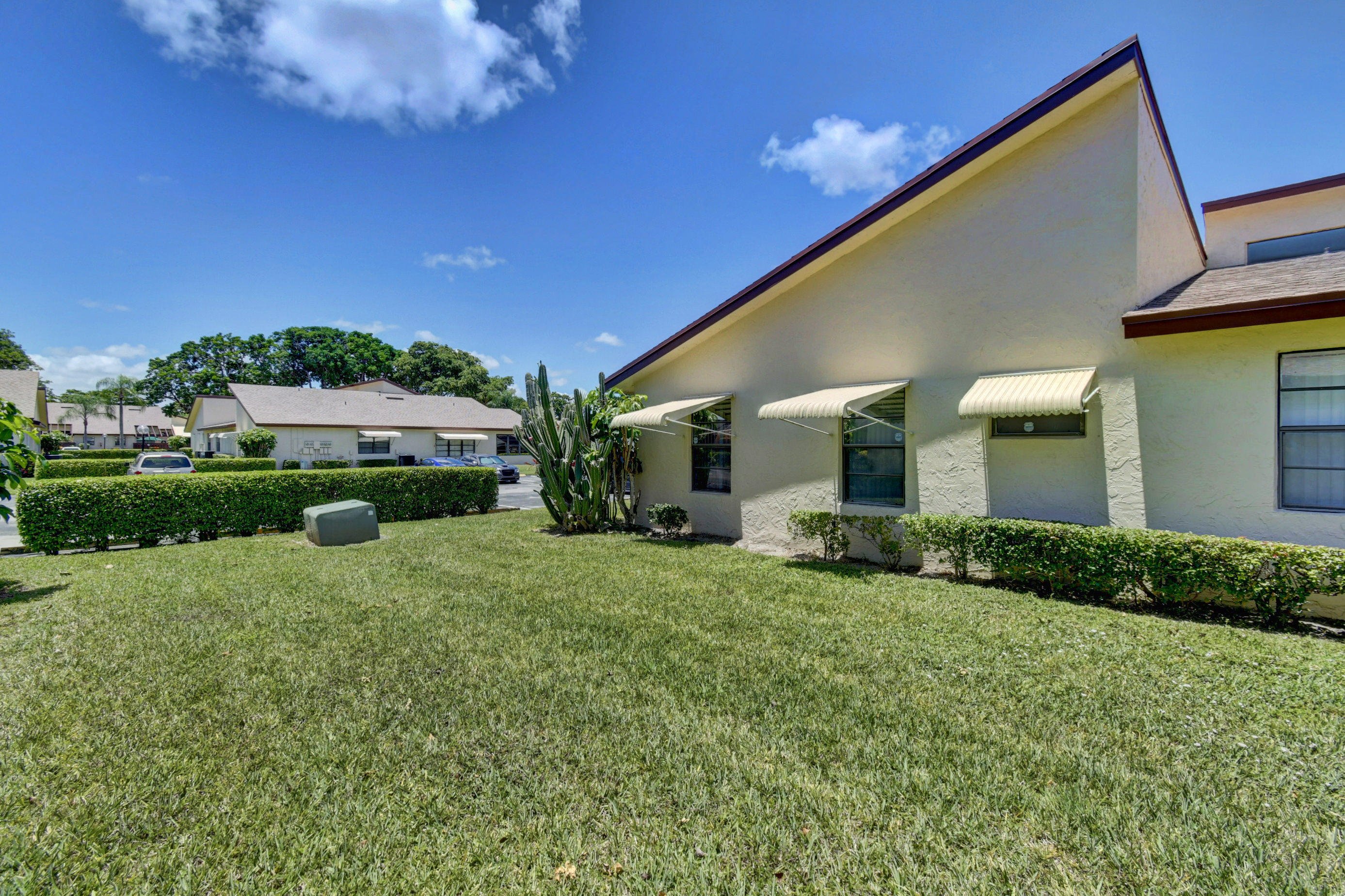 14163 Nesting Way, Unit D Delray Beach, FL 33484 - Photo 31 of 45 Side view of villa