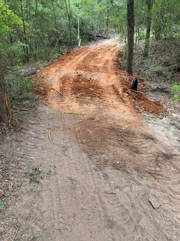 a view of a yard with an ocean view