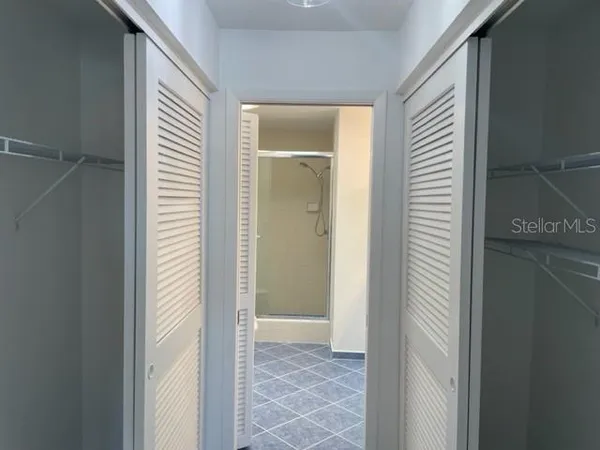 a view of a bathroom from a hallway