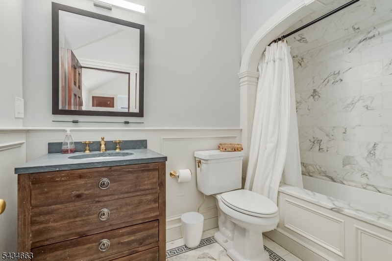 55 State Park Road Chester, NJ 07930 - Photo 16 of 48 a bathroom with a granite countertop toilet sink and mirror