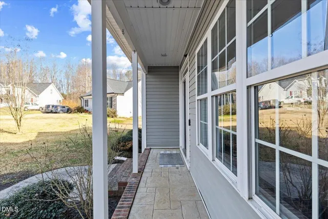 a living room with furniture and a book shelf