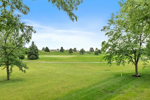 a view of a golf course with a lake