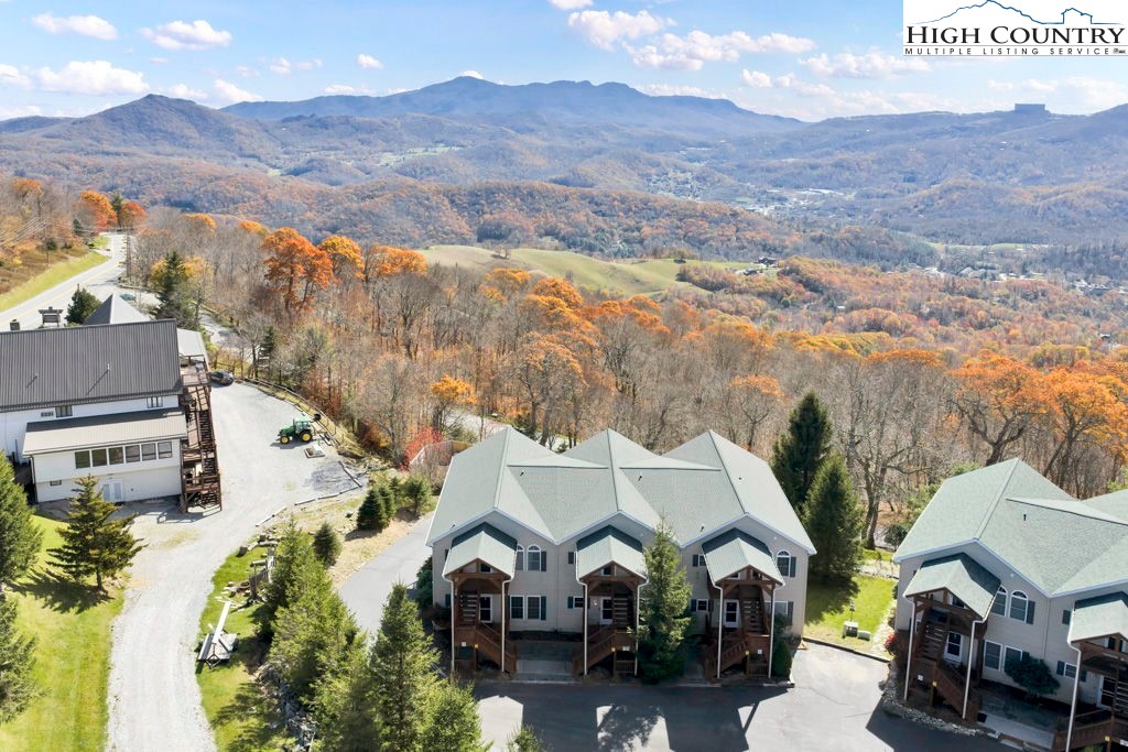 an aerial view of residential houses and outdoor space