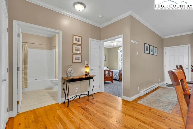 a bedroom with two beds and a window