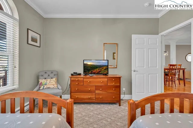 a bathroom with a granite countertop sink toilet and a mirror