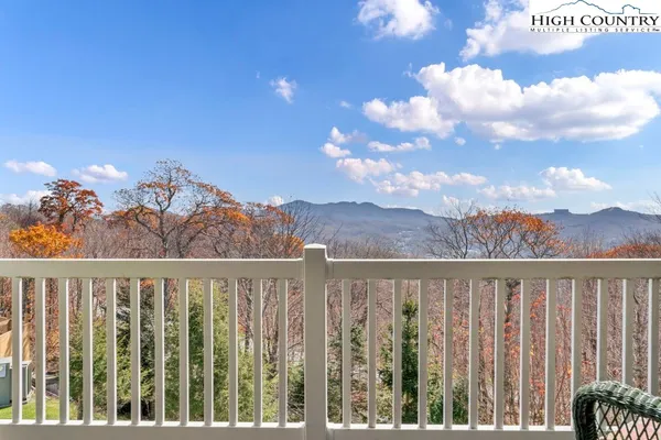 a view of a balcony with furniture