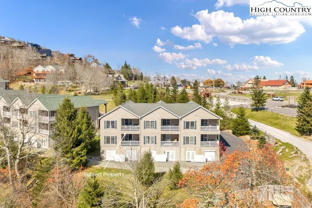 a view of entryway with wooden floor and stairs