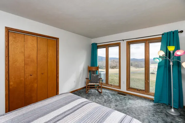 a view of a porch with wooden floor