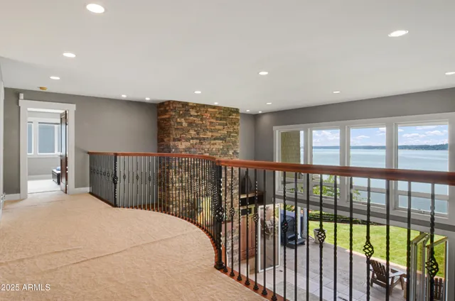 a view of a bedroom with wooden floor