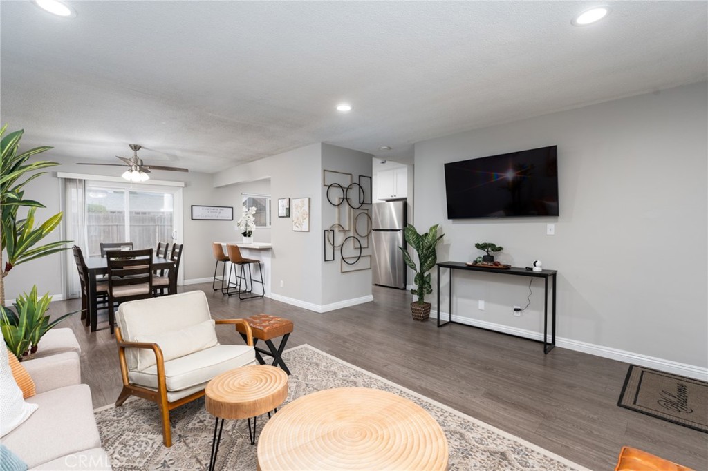 716 Orange Street Riverside, CA 92501 - Photo 6 of 28 a living room with furniture and a flat screen tv