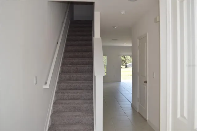 a view of hallway with stairs