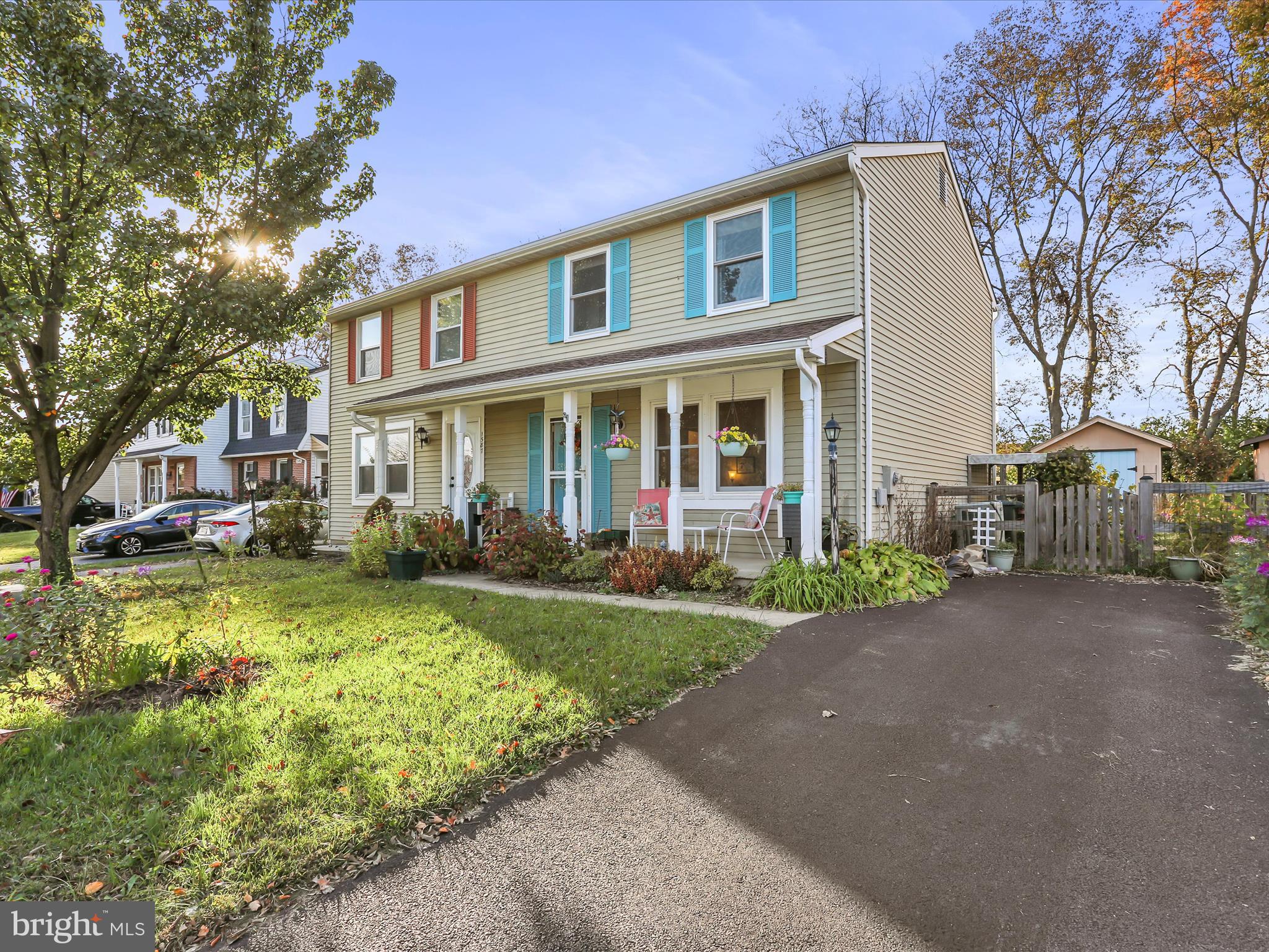 1589 Carey Place Frederick, MD 21701 - Photo 1 of 37 a front view of a house with a yard and porch