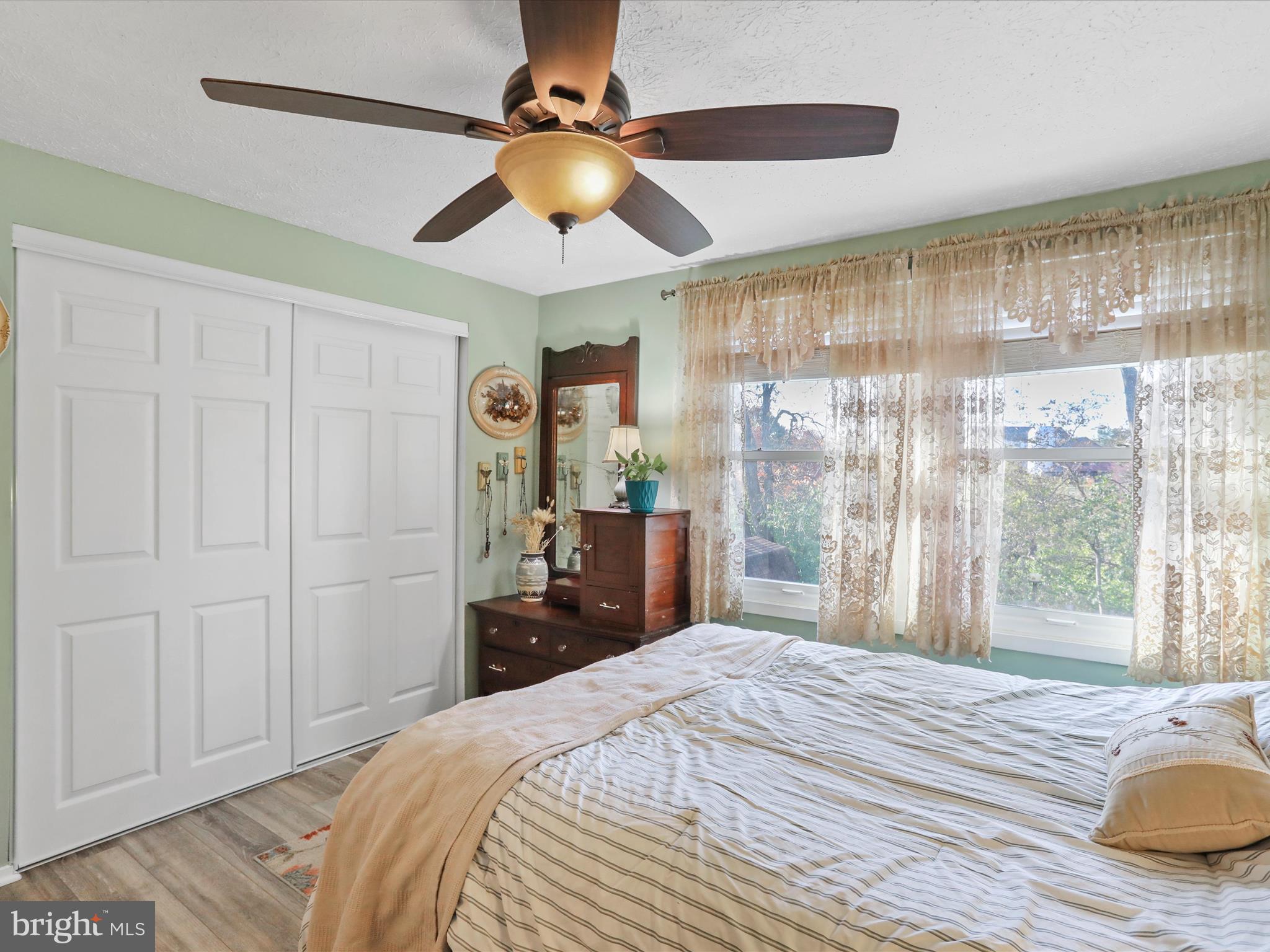 1589 Carey Place Frederick, MD 21701 - Photo 13 of 37 a bedroom with a bed and a chandelier