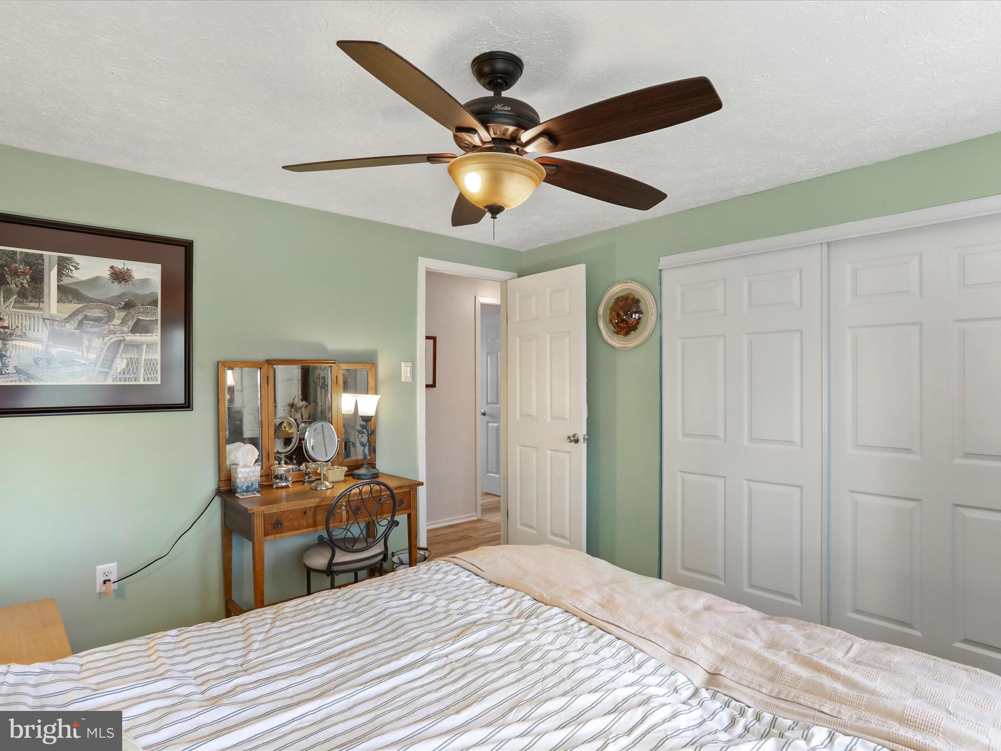 1589 Carey Place Frederick, MD 21701 - Photo 14 of 37 a bedroom with a bed and a chandelier