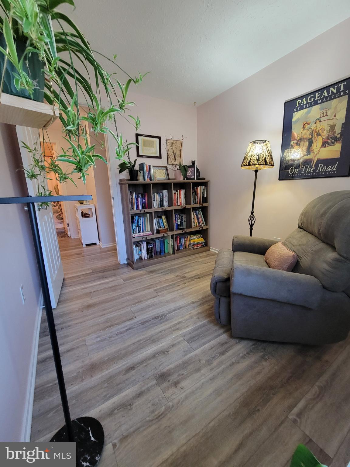 1589 Carey Place Frederick, MD 21701 - Photo 15 of 37 a living room with furniture and a book shelf