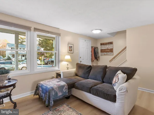a living room with a couch and a large window