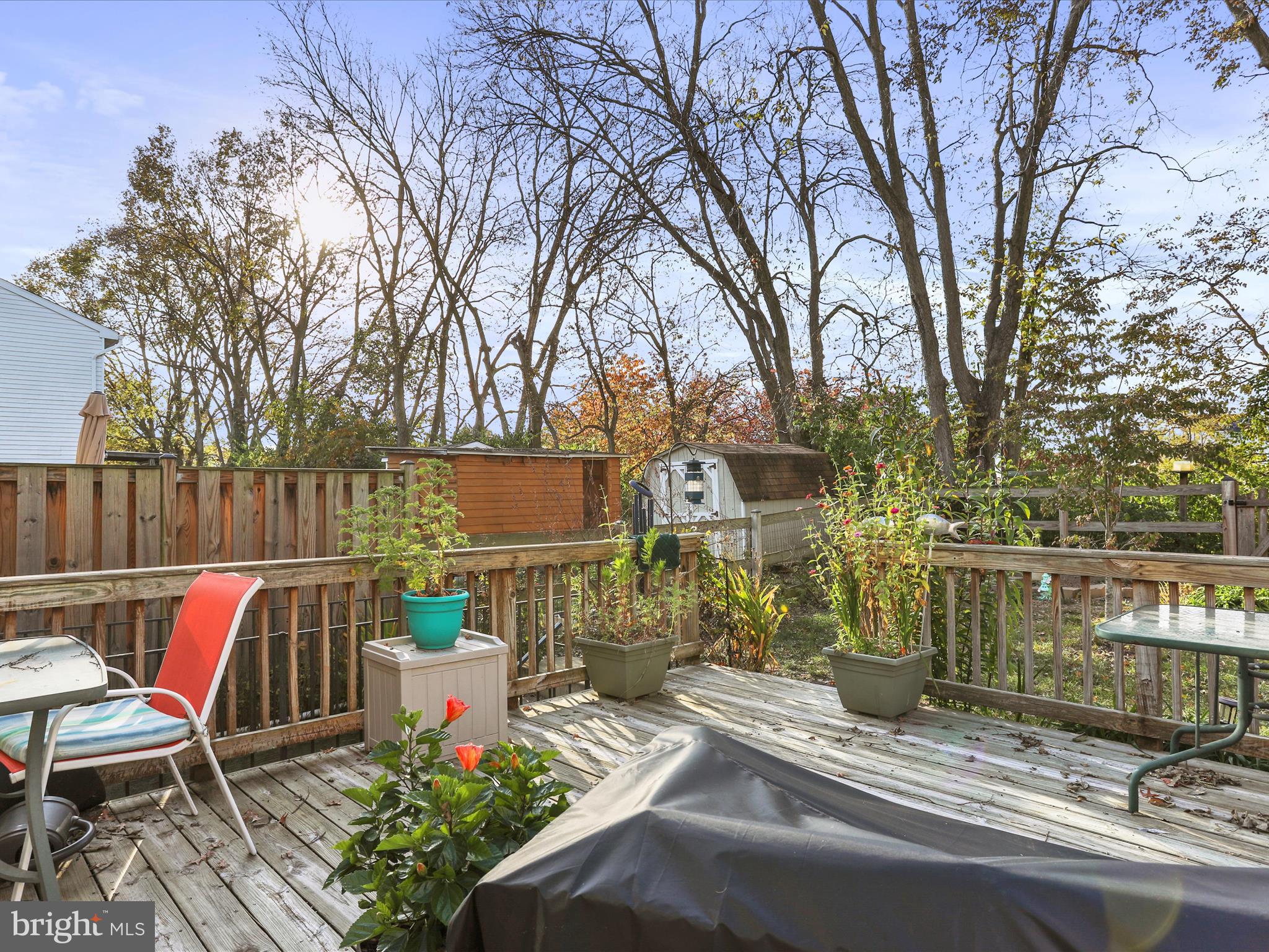 1589 Carey Place Frederick, MD 21701 - Photo 31 of 37 a view of a chairs and table in the back yard of the house