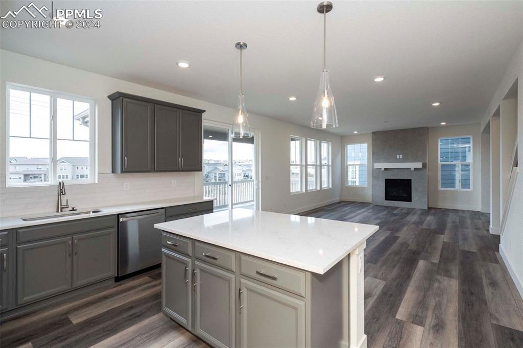 2058 Peachleaf Loop Castle Rock, CO 80108 - Photo 11 of 27 a kitchen with sink stove and refrigerator