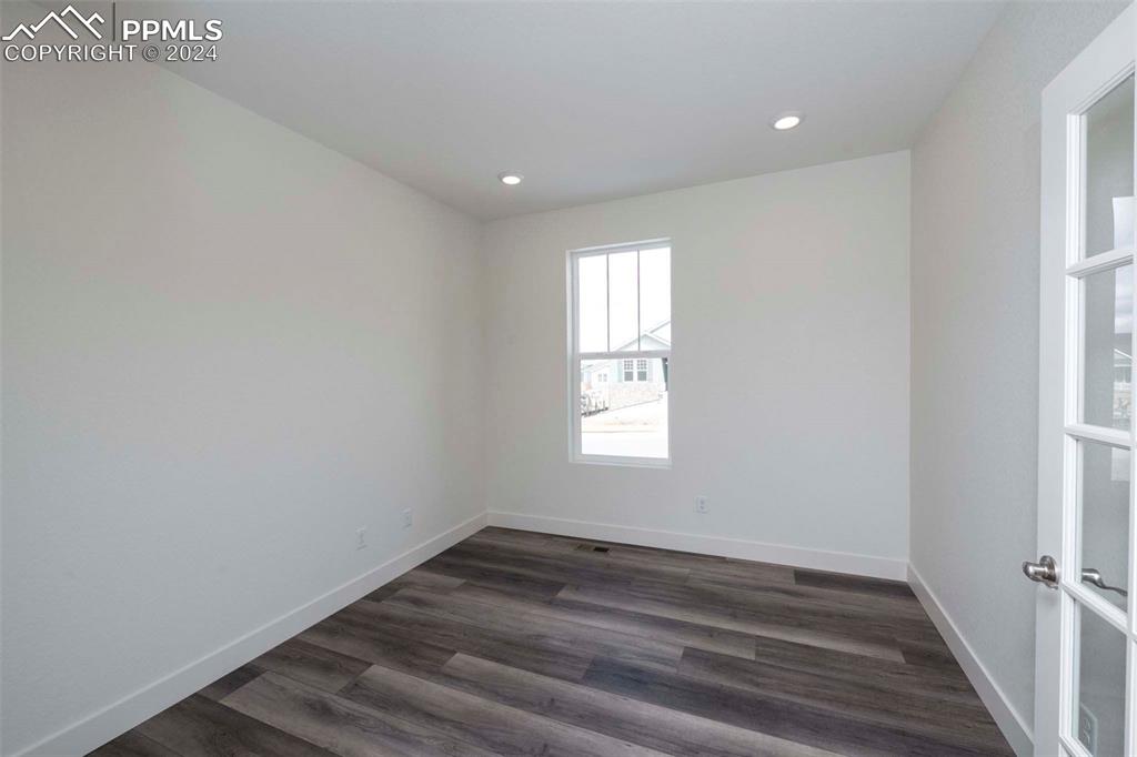 2058 Peachleaf Loop Castle Rock, CO 80108 - Photo 12 of 27 a view of empty room with wooden floor