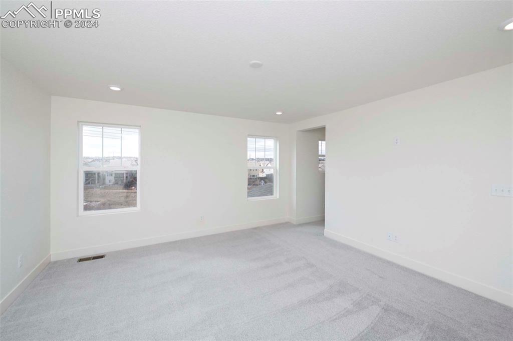 2058 Peachleaf Loop Castle Rock, CO 80108 - Photo 18 of 27 an empty room with windows