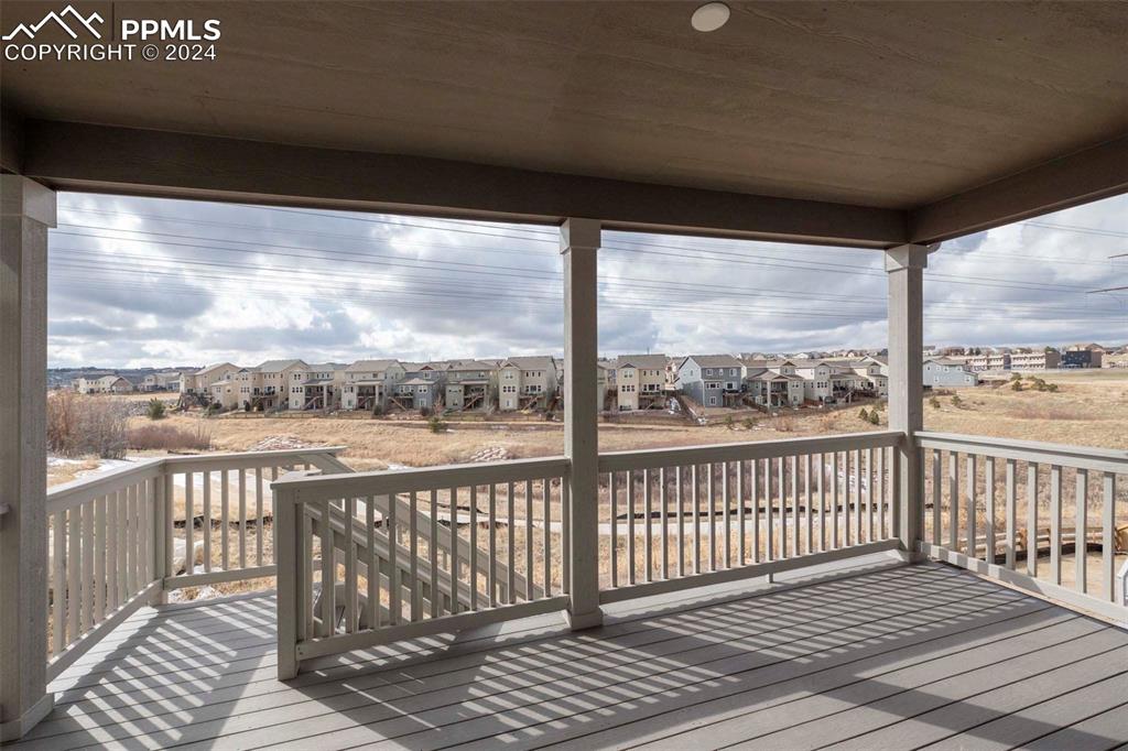 2058 Peachleaf Loop Castle Rock, CO 80108 - Photo 26 of 27 a view of a balcony with wooden floor