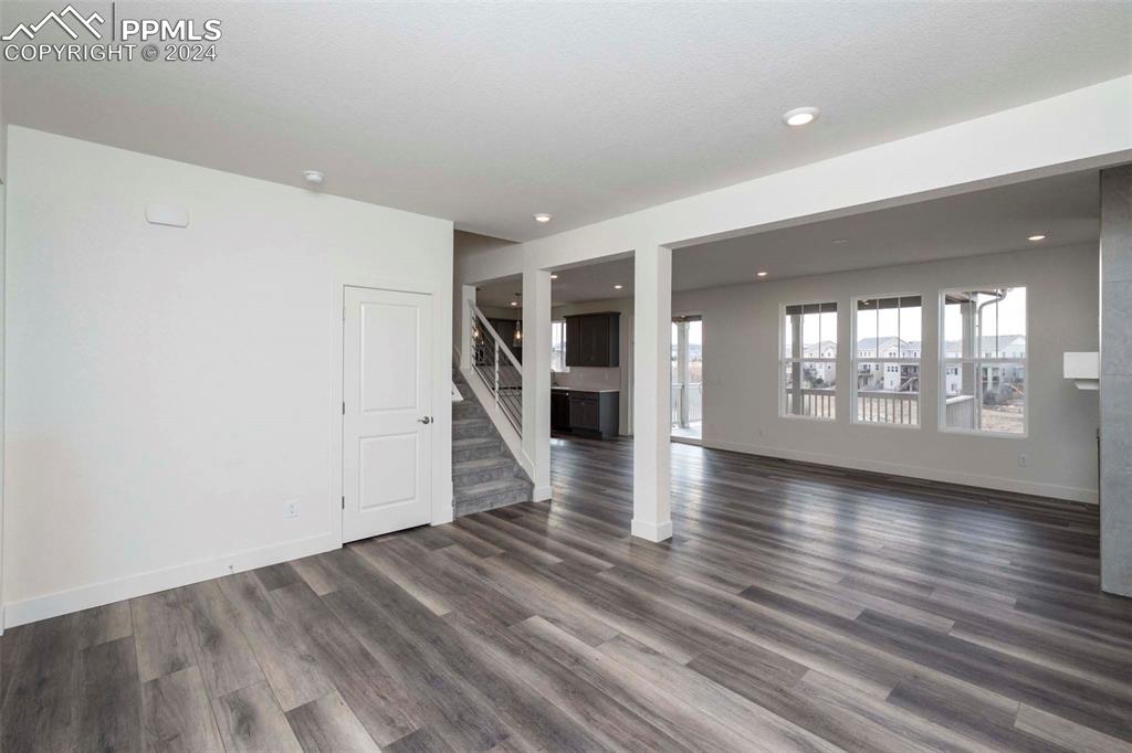 2058 Peachleaf Loop Castle Rock, CO 80108 - Photo 4 of 27 an empty room with wooden floor and windows