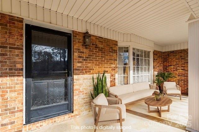 1214 Hawthorne Road Lancaster, SC 29720 - Photo 2 of 35 a porch with a table and chairs