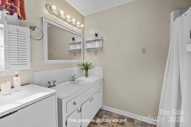 1214 Hawthorne Road Lancaster, SC 29720 - Photo 21 of 35 a bathroom with a sink and a mirror