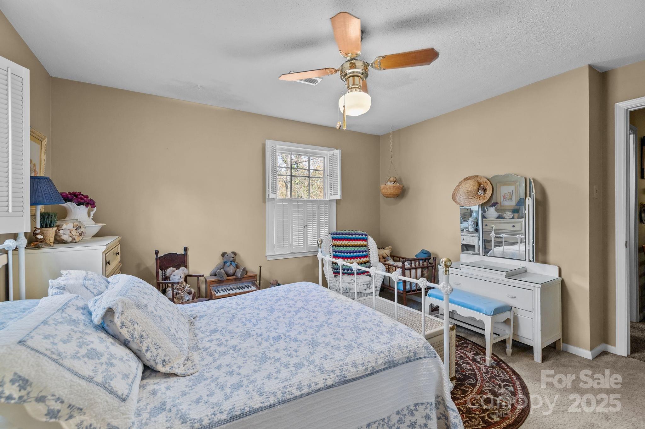 1214 Hawthorne Road Lancaster, SC 29720 - Photo 25 of 35 a bedroom with a bed and a chandelier