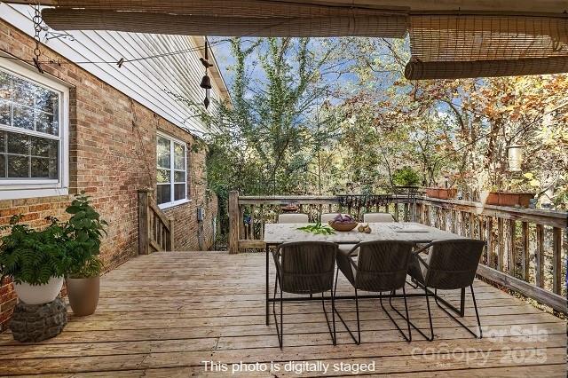 1214 Hawthorne Road Lancaster, SC 29720 - Photo 29 of 35 a balcony with wooden floor table and chairs