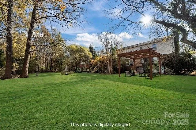 a view of a big yard with a house