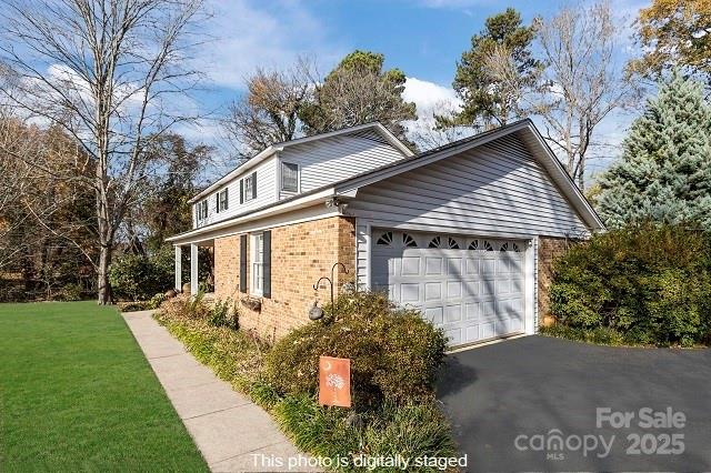 1214 Hawthorne Road Lancaster, SC 29720 - Photo 34 of 35 a front view of a house with garden
