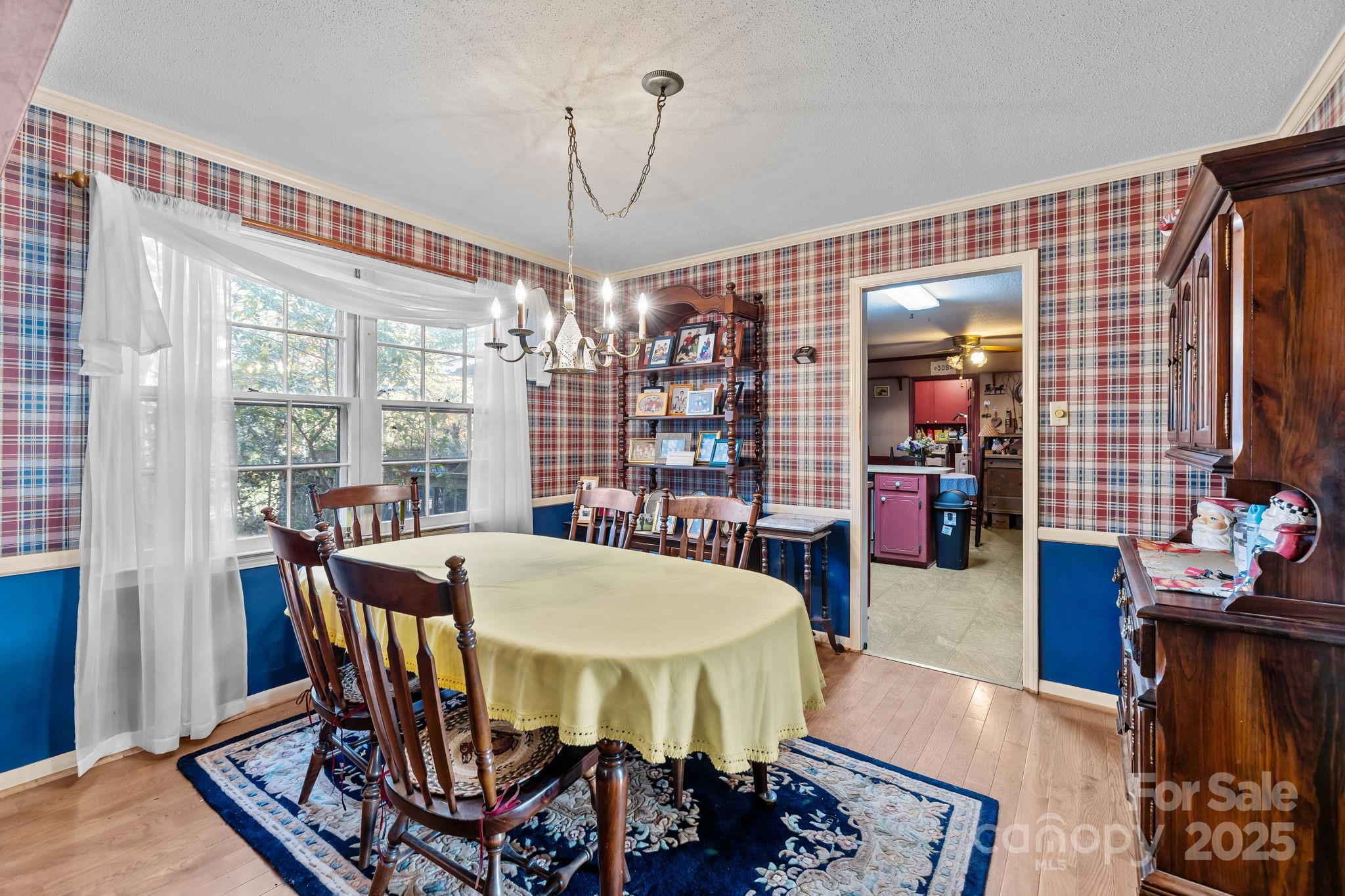 1214 Hawthorne Road Lancaster, SC 29720 - Photo 10 of 35 a view of a dining room with furniture window and wooden floor