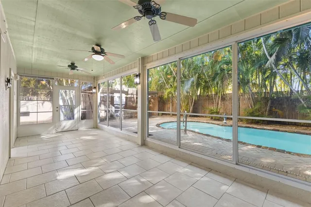 a backyard of a house with table and chairs