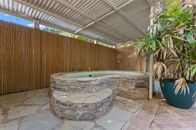 a backyard of a house with outdoor seating