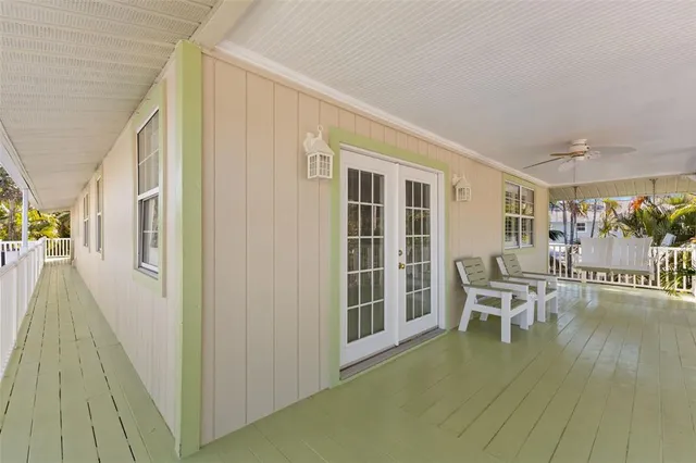 a bathroom with a granite countertop sink mirror vanity bathtub and toilet