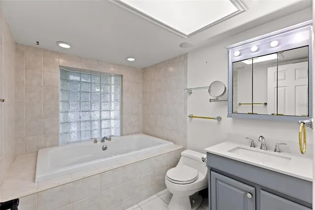 a living room with furniture and a ceiling fan